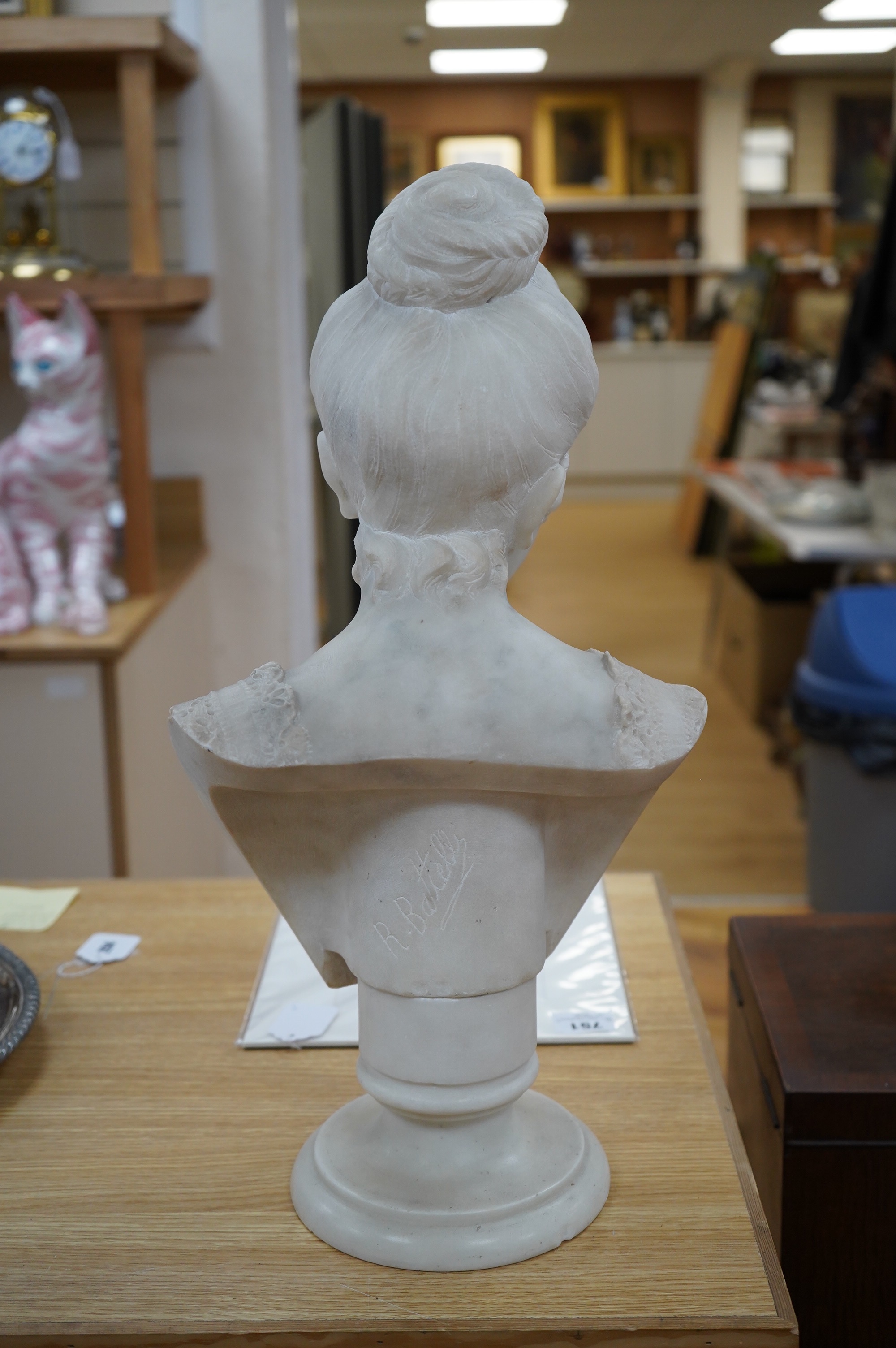 After Rafaello Battelli (Italian), a white marble bust of a lady, 54cm high. Condition - fair to good
